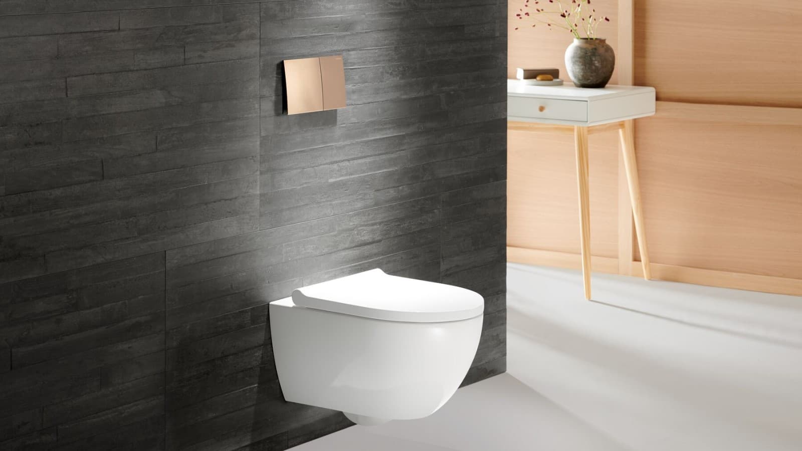 Geberit Acanto WC con placca di comando Sigma70 in oro rosa Geberit Acanto WC con placca di comando Sigma70 in oro rosa